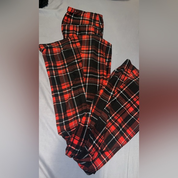 Red and black plaid flared stretch pants. - Picture 1 of 2